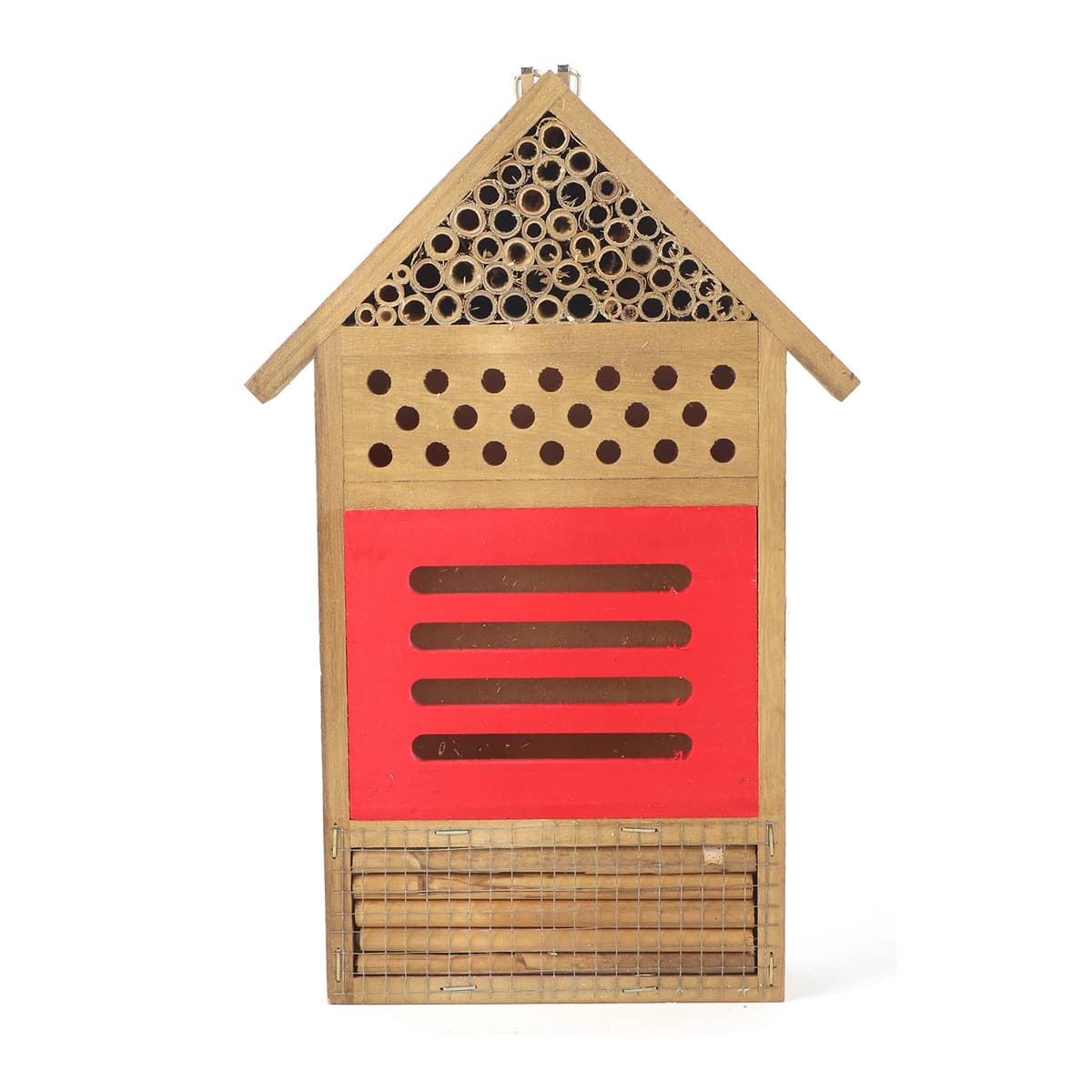 Abri à abeilles solitaires en bois garni de tubes calibrés derrière un panneau de façade